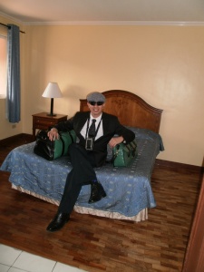 Dr. Atty. Noel G. Ramiscal modelling his two designed green and black leather portfolio and travelling bag