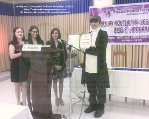 Dr. Atty. Noel G. Ramiscal receiving a certificate of appreciation from the gorgeous lady lawyers and officers of IBP Nueva Ecija, Nov. 12, 2015